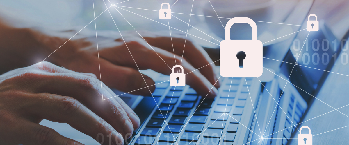 You can see someone working on their laptop with connected locks in white. This shows the security needed while working with sensitive data. 